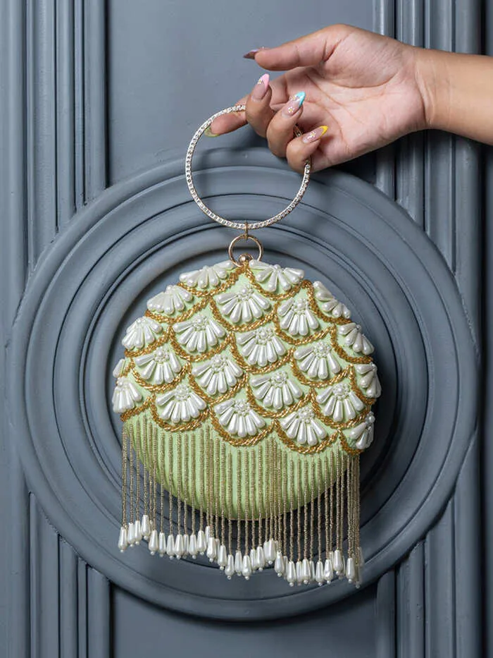 Irsa Round Hand Embroidered Clutch with Tassles